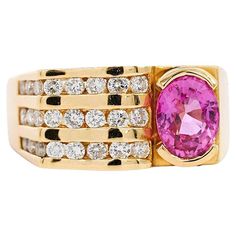 18K yellow gold ring, weighing 10.29 grams and boasting a size 8. Featuring a 2.77 Carat oval cut natural Pink Sapphire with a half bezel setting. Complemented with 24 round-cut diamonds in channel setting. The ring features a stunning horizontal square shape with thin edges, ensuring the ring hugs the finger. Offering a sharp art-deco style aesthetic. The sapphire features a vibrant, light pink with slight purple undertones. Excellent luster and brilliance. GIA Certificate comment: Center Stone Half Bezel Ring, Wide Band Engagement Ring, Half Bezel Setting, Opal Ring Vintage, Art Nouveau Ring, Gia Certificate, Half Bezel, Channel Setting, Silver Signet Ring