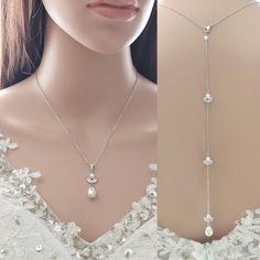 Simple and elegant pearl necklace, the classic design is complemented by a detachable backdrop, adding a touch of versatility and flair to your ensemble. Made using cubic zirconia pendant and the soft sheen of crystal pearls. It is put onto a fine rhodium plated brass chain. Comes with a cubic zirconia and teardrop detachable pearl backdrop. All material used is rhodium plated brass.  The pearls are in a soft white and goes well with white or light ivory dresses. Available in silver/rhodium fini Classic Bridal Necklace With Pearl Pendant For Wedding, Elegant Pearl White Drop Necklace For Wedding, Elegant Backdrop Necklace With Pearl Drop For Wedding, Formal Backdrop Necklace With Pearl Pendant, Elegant Pearl White Backdrop Necklace For Wedding, Teardrop Pearl Bridal Necklace For Wedding, Elegant Wedding Backdrop Necklace With Pearl Drop, Elegant Pearl White Wedding Backdrop Necklace, Formal Silver Pearl Backdrop Necklace