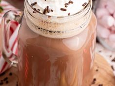 hot chocolate drink in a mason jar with whipped cream on top