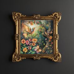 a painting hanging on the wall with flowers and birds in it's gold frame