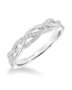 a white gold wedding ring with diamonds on the sides and an intertwined design in the middle