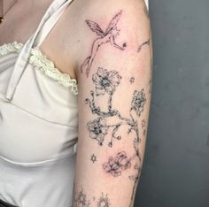 a woman with a tattoo on her arm