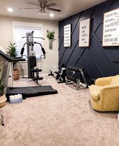 a home gym with an exercise bike, treadmills and other equipment in the room