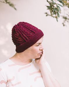 This pattern is a digital download. Difficulty: 3/5 Designer: Whitney Hayward Twisting cable stitches and raised bobbles paired with our fingering weight Shetland yarn make for a warm fall beanie, filled with texture. This hat is unisex sized, and can be knit to fit most adults. Finished Measurements Circumference: 19½” / 49 cm.Height (incl. folded brim): 8¼” / 21 cm. YarnHarrisville Shetland (fingering weight)100% Virgin Wool217 yards per 50 g skeinshown in Garnet 2 skeins or 338 yards of finge Cable Knit Yarn Beanie, Cable Knit Crochet Beanie Hat, Fall Beanie, Fall Beanies, Beret Pattern, Harrisville Designs, Cable Hat, Knitted Beret, Cable Knitting