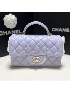 Gender: Women   Brand: CHANEL   Product Name: Classic Lambskin Gold Top Handle Mini Flap Bag Light Purple   Bags Alora Code: 13901947   Color: purple   Composition: Lambskin Leather   Origin: France   Features:  Chain Strap Leather Strap Lock closure    Designer Style ID AS2431 B06660 NF289 My Style Bags, Luxury Bags Collection, Aesthetic Bags, Girly Bags, Chanel Purse, Luxury Purses, Fancy Bags, Pretty Bags, Gold Top