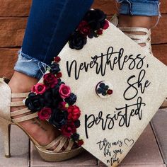 a graduate's cap with flowers on it and her name written on the front