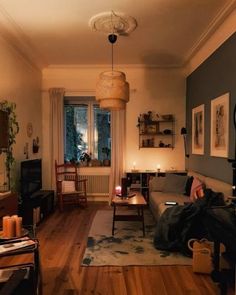 a living room filled with furniture next to a window