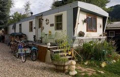 a trailer home with bicycles parked next to it