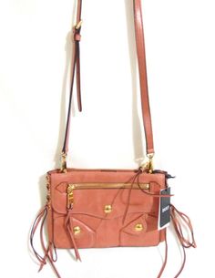 DKNY Small Dana Crossbody DP306 $298 DKNY Small Dana Crossbody DP306 $298 All items come from a NON-SMOKING & PET FREE environment. Buy with confidence! DKNY Small Dana Crossbody DP306                    1-in-D1          retail $298.00 It's all about the details with the DKNY Dana Crossbody. Lace-up side accents, front fringed pulls and shiny gold-tone hardware edge up this city-chic design. Small sized bag; approx W 9-1/4" x H 5-3/4" x 3D (width is measured across the bottom of handbag)  21"L t Dkny Bryant Crossbody Bag, Front Fringe, Velvet Choker, Tag Sale, Purple Velvet, Heart Studs, City Chic, Chic Design, Small Bag