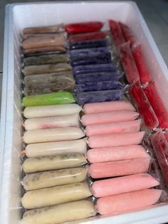 a tray filled with lots of different colored pops