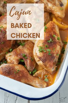 cajun baked chicken in a casserole dish with oranges and parsley