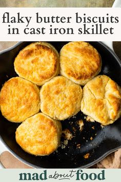 some biscuits are cooking in a skillet with text overlay that says, flaky butter biscuits in cast iron skillet