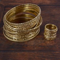 "Gold Filled Hammered Bangles, Hammered Bangles, Gold Filled Bangle, Gold Bamboo Bangles, Trendy Jewelry, Buy 2 Bangles 1 Stacking Ring Free ♥If you buy 2 Bangles 1 Stacking Ring Free This is a set of two very thin hammered 14k gold filled bangles. They are hammered into an elegant circle, and then double hammered in the center to give them a rustic forged look. Each is finished with a simple hook closure. These are dainty and versatile, the perfect set of bangles for a small touch of gold adorn Luxury Bohemian Bangle For Wedding, Affordable Brown Bangle Jewelry, Elegant Brown Bangle, Affordable Vintage Party Bangle, Gold Boho Jewelry, Gold Plated Brass Jewelry, Everyday Bracelets, Bracelets Boho