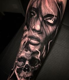 a woman's face and skull tattoo on the arm