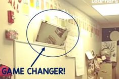 an image of a classroom with the word game changer circled by a magnifying lens