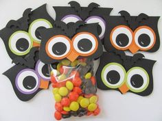 an assortment of halloween candies with owls on them