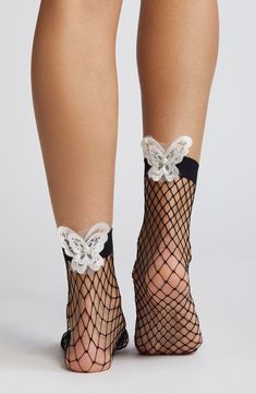 Embroidered butterflies put a whimsical spin on sassy fishnet socks edged by a wide band for a secure, comfortable fit. 85% nylon, 15% spandex Hand wash, line dry Imported Stretch Fishnet Stockings For Summer, Summer Stretch Fishnet Stockings, Summer Fishnet Mesh Hosiery, Summer Fishnet Hosiery, Party Fishnet Socks, Stretch Mesh Fishnet Socks, Stretch Fishnet Mesh Socks, Stretch Fishnet Socks Made Of Mesh, Stretchable Fishnet Mesh Socks