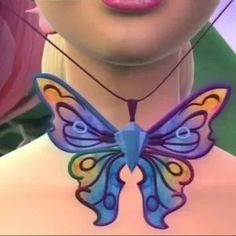 a close up of a woman wearing a butterfly necklace