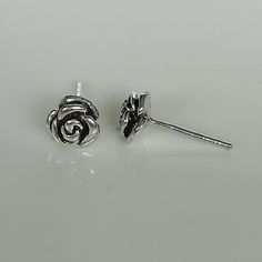 ▪︎ Sterling silver rose flower ear studs. Comes with an oxidized finish. ▪︎ Dimensions: 6.5 mm ▪︎ These studs are handmade with hypoallergenic 925 sterling silver ▪︎ I can send this piece in a gift box or include a gift message from you if required. ▪︎▪︎ Please read my shipping policies for shipping durations. ▪︎▪︎ Do contact me if you have any questions at nkapoor1955@gmail.com ➤ For more ear hoops please browse https://www.etsy.com/shop/NeverEndingSilver?ref=seller-platform-mcnav&section_i Silver Studs For Pierced Ears As Gift, Silver Stud Earrings As Gift, Silver Sterling Earrings With Rose Design, Studs Piercing, Yin Yang Bracelet, Yin Yang Charm, Wanderlust Jewelry, Flower Ear, Silver Wings