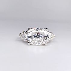 three stone diamond ring on white background