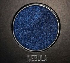 a blue eye shadow with the word nebula on it