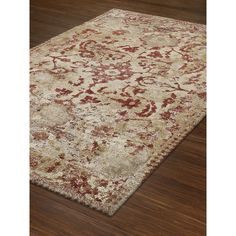 a large rug with red and beige colors