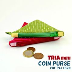 there is a small coin purse next to some coins on the table with text overlay that reads tria mini coin purse