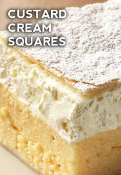 a close up of a piece of cake on a plate with the words custard cream squares above it