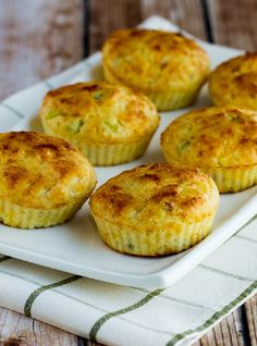 several small muffins on a white plate