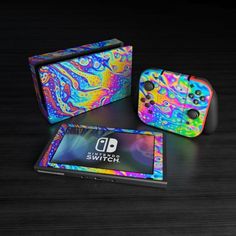 an image of a nintendo wii game console and controller cover with colorful swirls on it