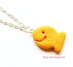 In stock and ready to ship! Goldfish cracker necklace! 100% handmade from polymer clay It looks adorable and realistic. Goldfish cracker size: around 0.8-0.9 inch big. Necklace chain is around 19 inches long, and silver color. The listing price is for one necklace. It's fragile clay sculpture. If you bend or pull hard on it, it could break! Please wear it carefully! Thank you Cracker Necklace, Snack Necklace, Goldfish Crackers, Fish Necklace, Food Earrings, Necklace Cute, Food Jewelry, Kawaii Food, Cute Cookies