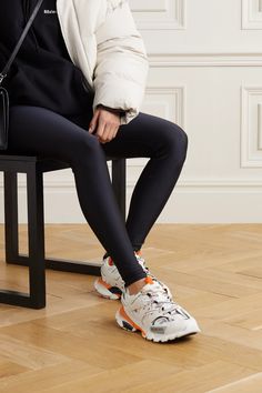 This white and orange iteration of Balenciaga's 'Track' sneakers will go with practically anything, from sweater dresses and sharp tailoring. Set on the signature chunky sole, they're made from rubber and mesh and detailed with the label's logo printed and debossed at the toe. The padded collars and tongue ensure a comfortable fit. Balenciaga Track Outfit Woman, Balenciaga Track Outfit, Track Outfits, Balenciaga Track Sneakers, Track Sneakers, Balenciaga Shoes Sneakers, Rubber Sneakers, Track Shoes, Orange Outfit