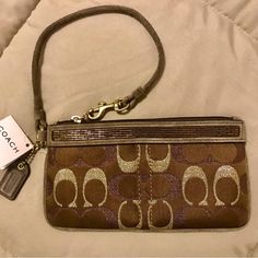 Stunning & Very Rare Vintage Coach Wristlet In A Beautiful Chocolate Brown. Stitching Is Gold & Bronze Along W/Shiny Beading. Great For Fall & Winter! You Can Dress Up Or Down For A Party Or W/Jeans. Please Ask Any Questions & Happy Holidays!! Beautiful Chocolate, Coach Wristlet, Vintage Coach, Brown Gold, Chocolate Brown, Very Rare, Coach Bags, Happy Holidays, Beading