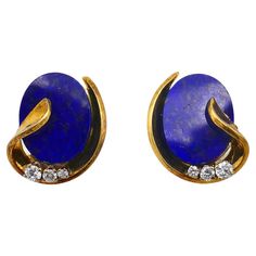 A pair of fine Vintage earrings, made of 18k gold and lapis, featuring diamond. Bright yet delicate gold earrings with the oval shape flat lapis. The stone is beautifully framed in gold of leafy design. The bottom of the earrings is adorned with 3 graduated size diamonds. The earrings are stamped with the maker's mark and a hallmark for 18k gold. About lapis lazuli jewelry Lapis lazuli is easy to recognize because of a distinct combo of a deep blue color and gold flecks. This semi-precious gemstone has been in use since antiquity. It’s considered one of the oldest gems in history as it’s 6,500 years old. Being a base for ultramarine color, lapis had a crucial meaning for the Renaissance and Baroque artists. For instance, a famous bright blue scarf of Vermeer’s Girl with a pearl earring was Delicate Gold Earrings, Girl With A Pearl Earring, Lapis Lazuli Jewelry, Gold Flecks, Greenish Blue, Pearl Earring, Blue Scarf, Maker's Mark, Jewelry Store