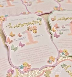 there are some cards with butterflies on them and the numbers one is for each child's first birthday