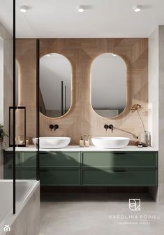 a bathroom with two sinks and mirrors on the wall