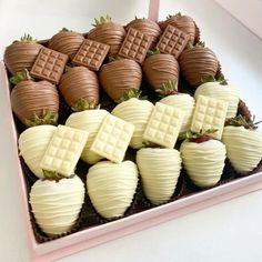 chocolate covered strawberries in a pink box on a table