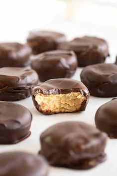 chocolate covered doughnuts with peanut butter in the middle