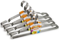 a set of six stainless steel clothes hangers with tags attached to each one on an isolated white background