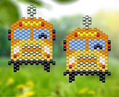 two cross stitch cars sitting on top of each other in front of green grass and yellow flowers