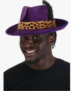 This deluxe purple velour fedora with leopard print band and black feather trim is a perfect hat for a gangster, pimp, 20's or 40's outfit, 80's looks or other character. Includes a firm lightweight character hat made from a crush resistant material. This classic hat is designed for larger adult head sizes. Pimp costumes and accessories (glasses, walking canes, jewelry, wigs) are sold separately on our page – subject to availability. Winter Party Fedora Costume Hat, Brimmed Costume Hats For Fall Parties, Brimmed Costume Hats And Headpieces For Fall Party, Halloween Fedora Costume Hat, Fitted Fedora Halloween Costume Hat, Fall Party Costume Hats And Headpieces With Brim, Fitted Fedora Costume Hat For Halloween, Fall Party Brimmed Costume Hats And Headpieces, Pimp Outfits