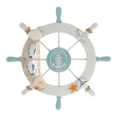 a white and blue decorative wheel with shells on the rim, starfishs hanging from it's sides