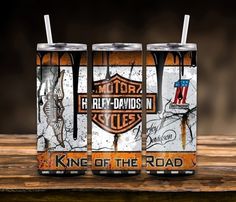 two cans of harley davidson king of the road on wooden table with black and white background