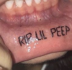 the word rip all pee is written on someone's left side of his mouth