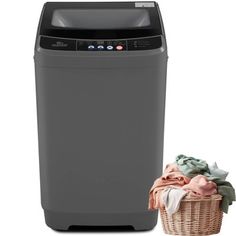 a washing machine next to a laundry basket