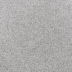 a plain grey fabric textured up close to the surface with no visible lines or dots