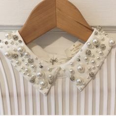 This Top Is So Classic And Can Dress Up Any Outfit! Looks Great With Skirts, Trousers, Denim Or My Favorite Under A Dress Or Sweater To Pop That Sparkle Pearl Collar. Never Worn With Tags! All Pearls/Sequins In Place And Comes With Packet Of Extra In Case You Were To Lose One In The Future! Runs Slightly Big, Im A Medium Normally And Sized Down. Slightly Sheer But Is Perfect With A Nude Bra Or Cami! Very Soft And Smooth On The Skin. Pearl Top Outfit, Pearl Collar, Outfit Looks, Nude Bra, Big Pearl, Collar Blouse, White Silver, Diy Fashion, The Future