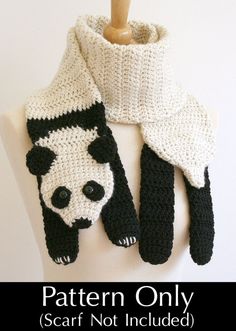 a crocheted panda bear scarf on a mannequin