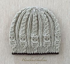 a knitted hat is shown on the wall