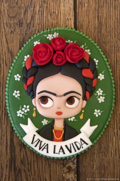 frida lavida with roses on her head and name in the middle, surrounded by flowers